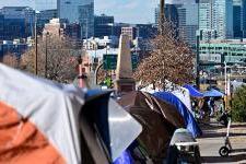 row of tents overlooking denver city centre 